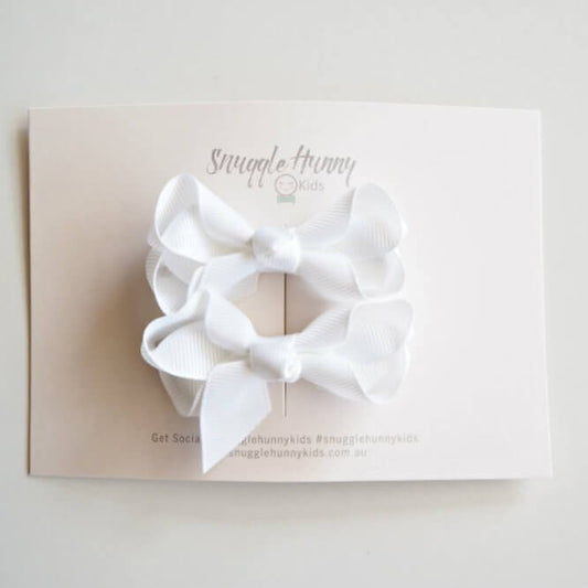 white-clip-bow-small-piggy-tail-pair-image